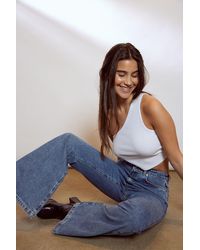 ausgestellte Jeans in Blau NA-KD Denim Trend Recycelte weit geschnittene Damen Bekleidung Jeans Bootcut Jeans 