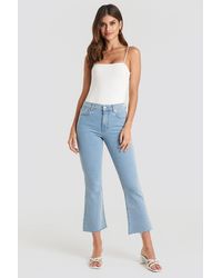 NA-KD Raw Hem Kick Flare Jeans - Blauw