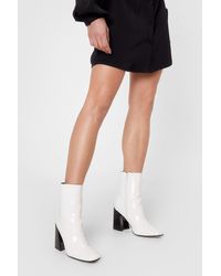 white heeled boots
