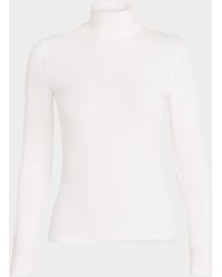 FRAME - Ribbed Turtleneck Top - Lyst