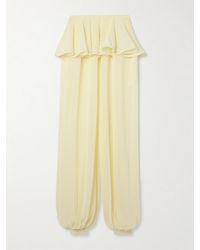 Alaïa - Pleated Georgette Peplum Tapered Pants - Lyst