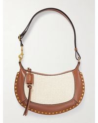 Isabel Marant - Oskan Moon Studded Leather-Trimmed Raffia Shoulder Bag - Lyst
