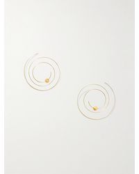Alaïa - Thin Spiral Goldfarbene Ohrringe - Lyst