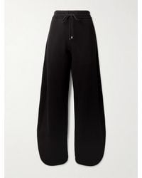 Alaïa - Petal Cotton-Jersey Barrel-Leg Track Pants - Lyst