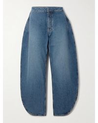Alaïa - High-Rise Barrel-Leg Jeans - Lyst