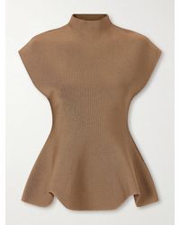 KHAITE - Andra Stretch-Knit Turtleneck Peplum Top - Lyst