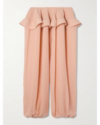 Alaïa - Pleated Georgette Peplum Tapered Pants - Lyst