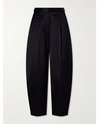 Alaïa - Pleated Cotton-Blend Tapered Pants - Lyst