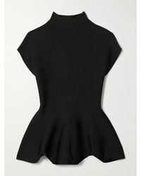 KHAITE - Andra Stretch-Knit Turtleneck Peplum Top - Lyst