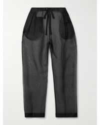 KHAITE - Trenton Pleated Silk-Organza Tapered Pants - Lyst