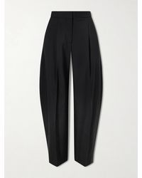 Alaïa - Pleated Wool-Blend Gabardine Tapered Pants - Lyst