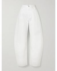 Alaïa - Mid-Rise Barrel-Leg Jeans - Lyst