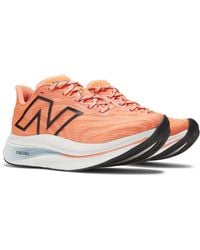 New Balance - Fuelcell Supercomp Trainer V2 In Orange/black Synthetic - Lyst