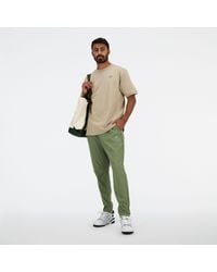New Balance - Ac Tapered Pant 29" In Green Polywoven - Lyst