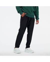 New Balance - Ac Tapered Pant 29" In Black Polywoven - Lyst