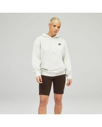 new balance relentless cinched hem hoodie