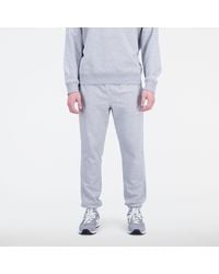 New Balance - Pantaloni da tuta essentials stacked logo french terry sweatpant in grigio - Lyst