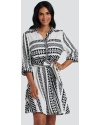 South Beach - Abstract Print Belted Mini Dress New Look - Lyst