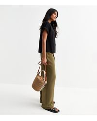 New Look - Dark Pleated Front Wide Leg Trousers - Lyst