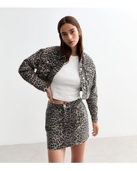 New Look - Leopard Print Denim Mini Skirt - Lyst
