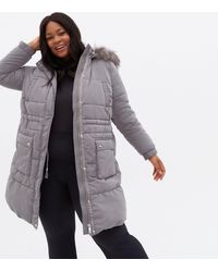 grey belted puffer coat