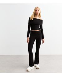 New Look - Soft Rib Foldover Flared Trousers - Lyst