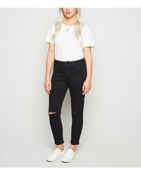 petite black ripped skinny jeans