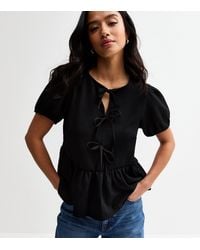 New Look - Petite Crinkle Texture Tie Front Peplum Top - Lyst