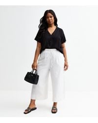 New Look - Plus Size Wide Leg Woven Cropped Trousers Curves - Lyst
