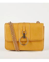 new look mustard clutch bag