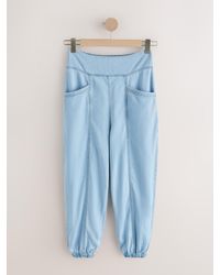 Next - Tencel Blend Lightweight Denim Balloon Trousers - Lyst