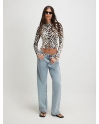 River Island - Long Sleeve Leopard Print Ribbed Button Front Top - Lyst