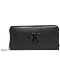 Calvin Klein - Embossed Monogram Long Zip Wallet - Lyst