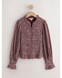 Next - Burgundy Ditsy Floral Print Smocked Button Front Long Sleeve Blouse - Lyst