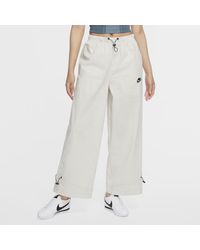 Nike Wide-leg and palazzo pants for Women - Up to 41% off at Lyst.com