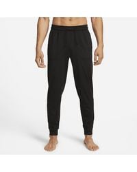 Nike - Yoga Dri-fit joggers 50% Recycled Polyester - Lyst