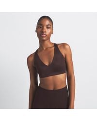 Nike - Skims Shine V-Neck Bra - Lyst