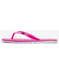 pink nike flip flops