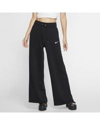 Nike Wide-leg and palazzo pants for Women - Up to 29% off at Lyst.com