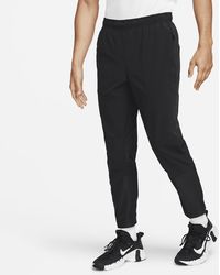 Nike A.P.S. Men's Dri-FIT ADV Woven Versatile Pants.