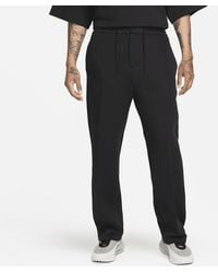 Nike - Pantaloni tuta loose fit con orlo aperto sportswear tech fleece reimagined - Lyst
