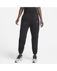 Nike - Dri-fit Fast Mid-rise 7/8 Warm-up Running Trousers Polyester - Lyst