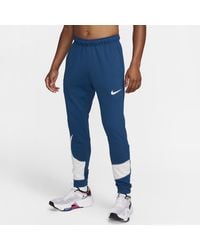Nike - Dri-fit Fitnessbroek Met Taps Toelopend Design - Lyst