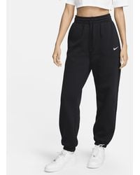 Nike - Pantaloni tuta oversize a vita alta sportswear phoenix fleece - Lyst