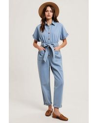 Modenaire - Short Sleeve Button Front Tie Waist Rolled Cuff Denim Jumpsuit - Lyst