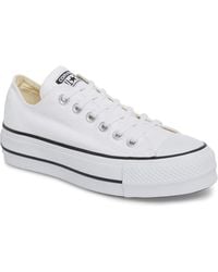 white leather converse lift