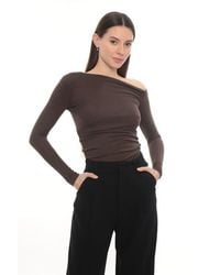 Monlicia - Lune Asymmetric Off-Shoulder Long Sleeve Stretch Top - Lyst
