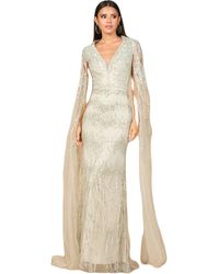 LARA New York - V-Neck Gown With Long Cape Sleeves And Feathers - Lyst