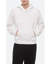 Helmut Lang - Embossed Studio Logo Hoodie - Lyst