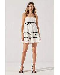 Modenaire - Spaghetti Strap Mini Dress With Ruffled Trim And Bow Accents - Lyst